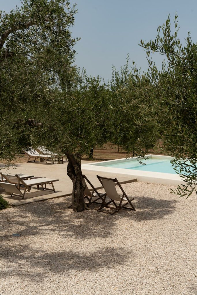swimming pool and deck chair area in puglia
