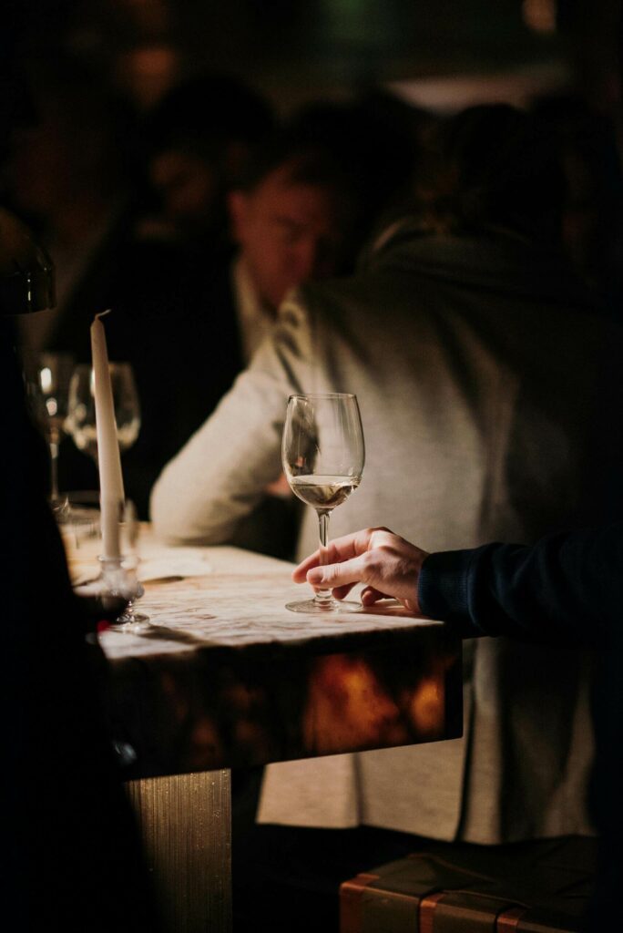 moody bar and glass of wine