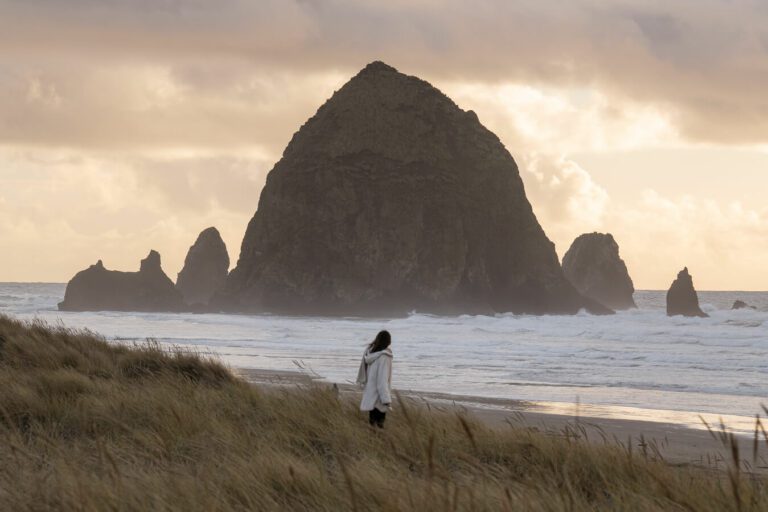 woman in front of haystack rock cannon beach or