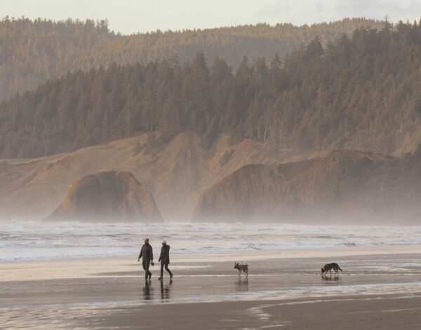 dog walkers on cannon beach or