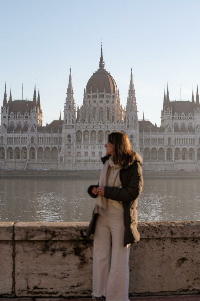 woman in front of parliament building budapest