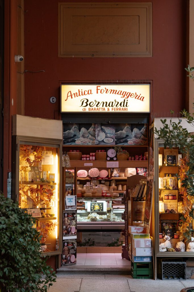 a cheese shop in a market in bologna