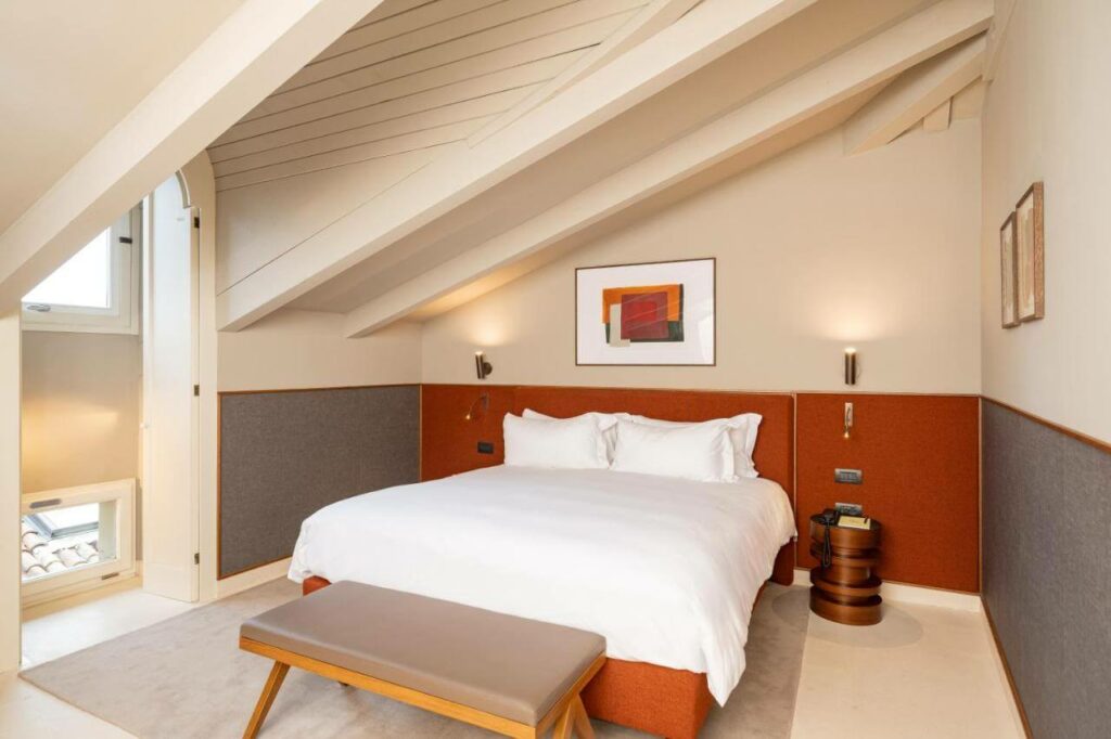 a simple modern room at one of the top boutique hotels in bologna italy