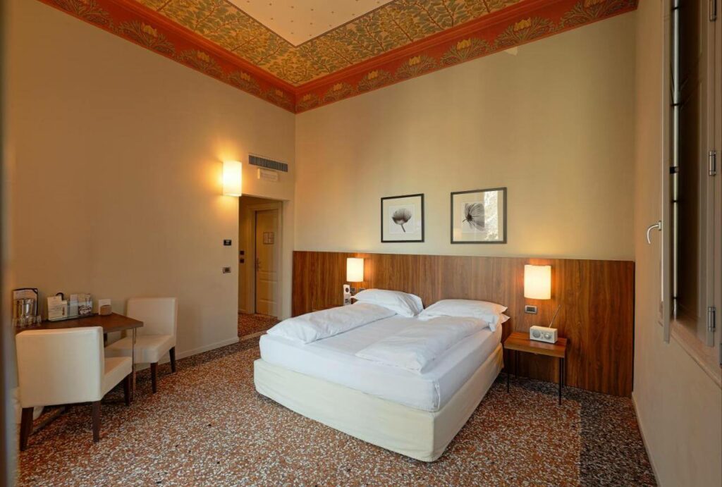 a classic design room at a top luxury hotel in bologna italy