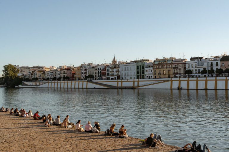 sunset on the riverbank facing triana seville spain