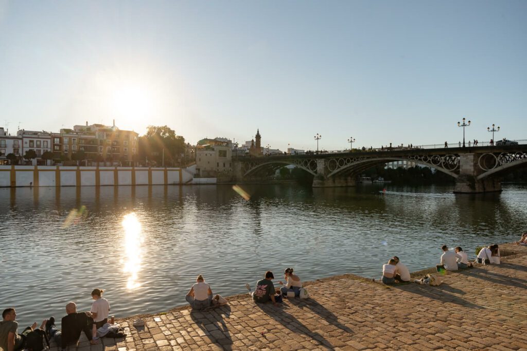 Isabel II bridge and river at sunset