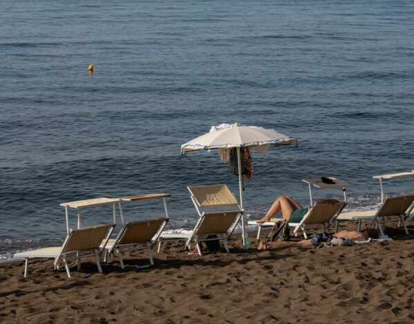 loungers on the beach in procida