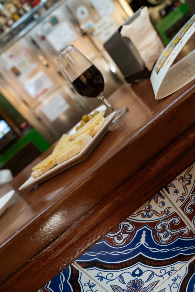 tapas and glass of vermouth on a tapas bar in seville