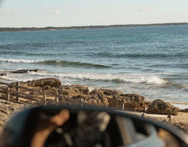 sea view with car mirror in puglia italy