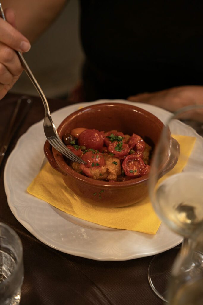 roasted fish with tomato in naples italy