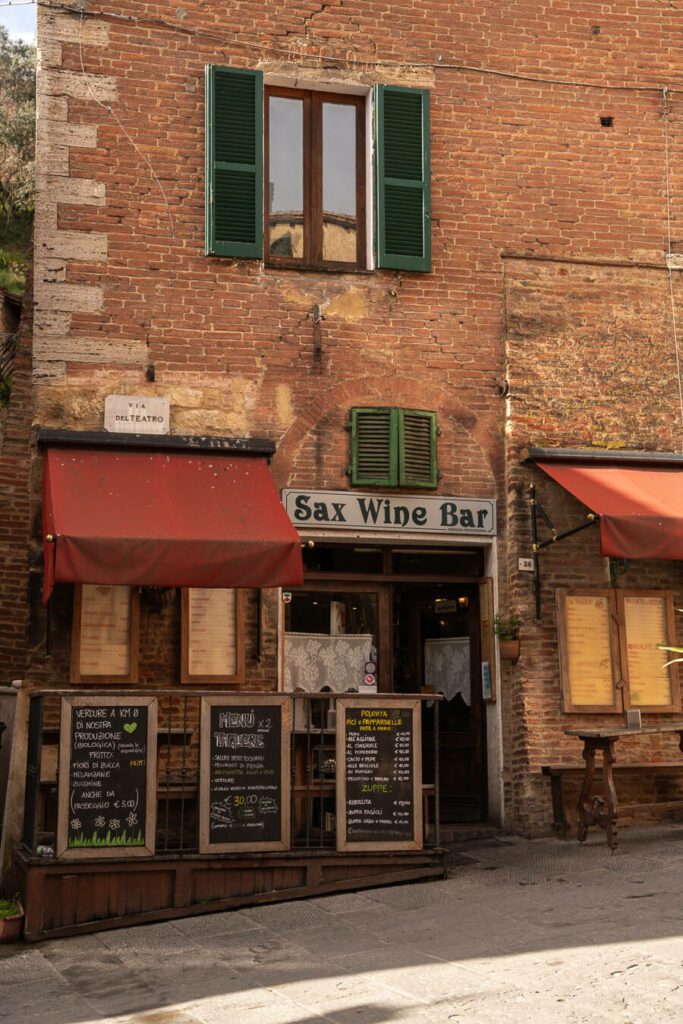 street with wine bar in montepulciano italy