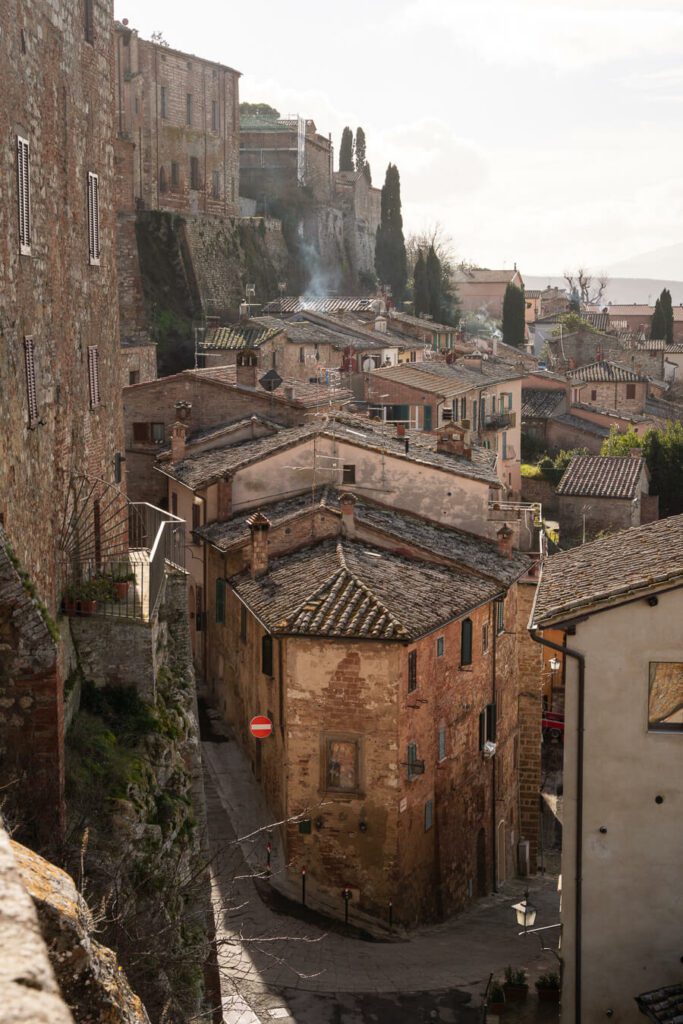 view on to montepulciano below, red brick houses