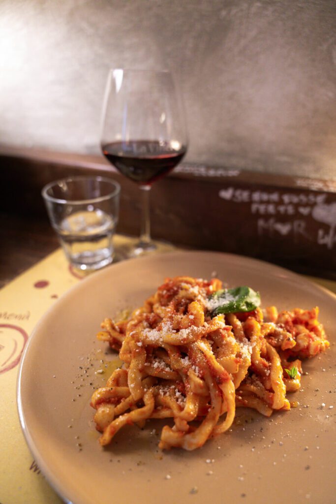 pasta and rosso wine in italy