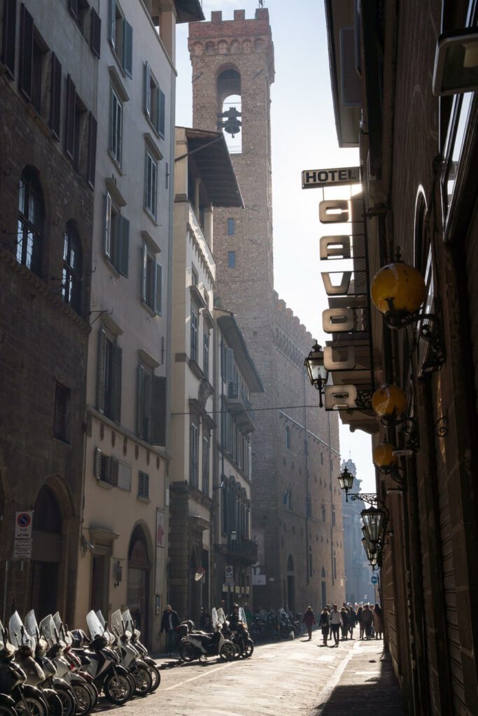 sunlit street in florence italy
