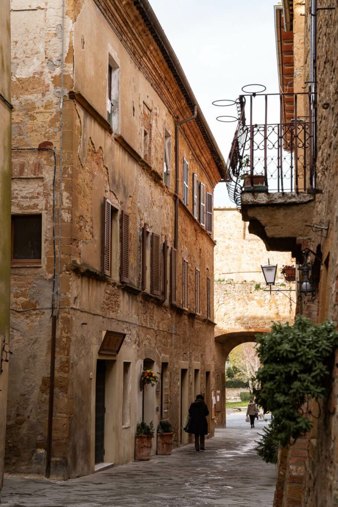 main street with locals in th tuscany town of pienza