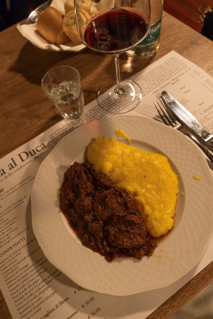 horse meat stew with polenta at an osteria in verona italy