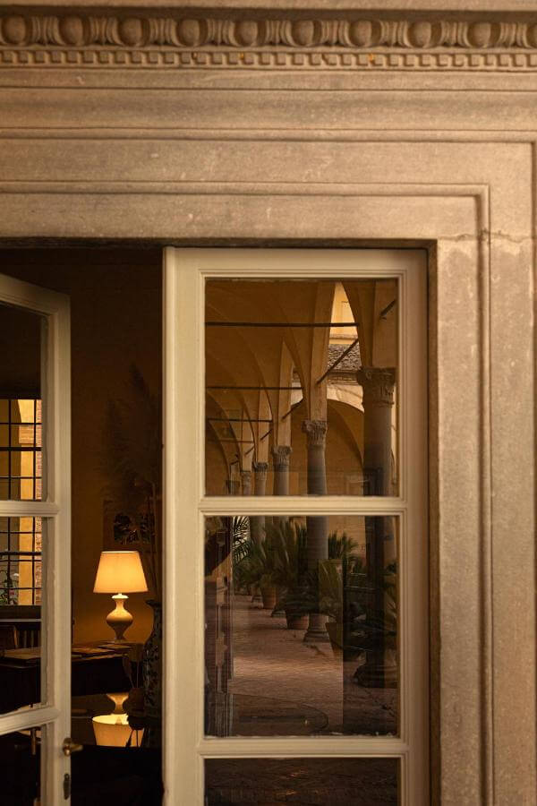 where to stay in siena, hotel certosa doors with reflection