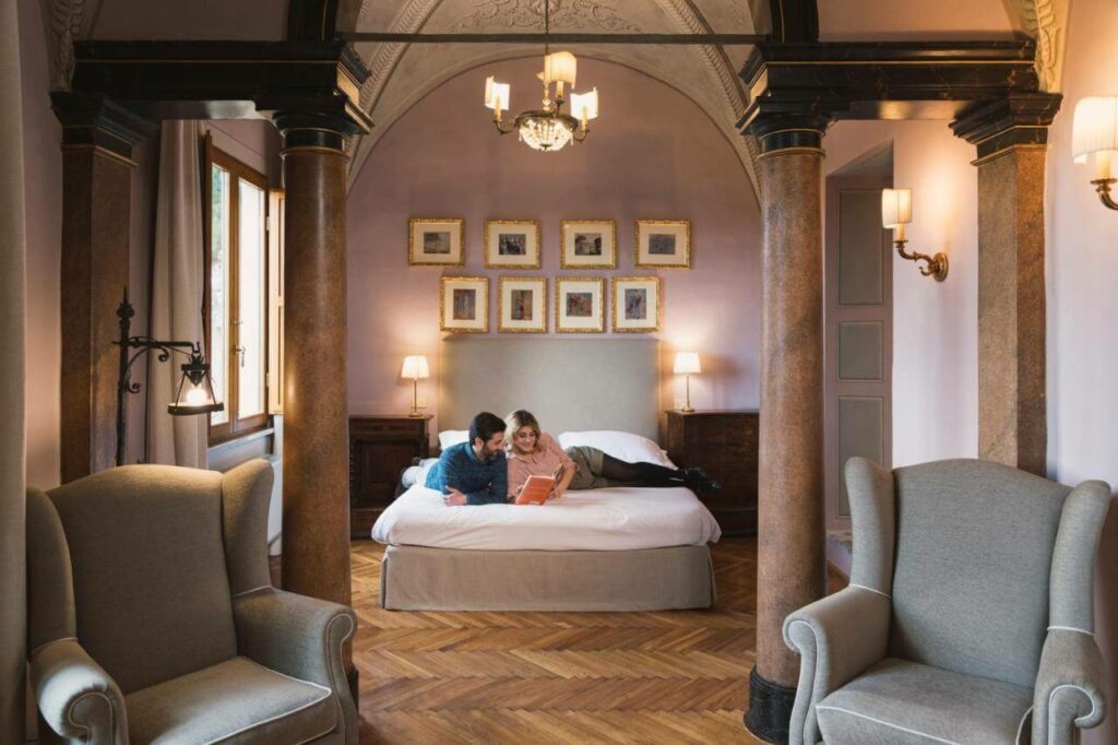 couple in a room at palazzo ravizza in siena italy