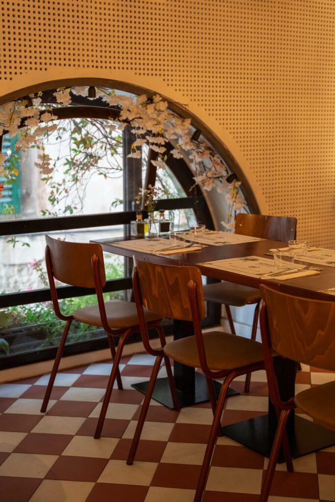 arch with tables in split restaurant