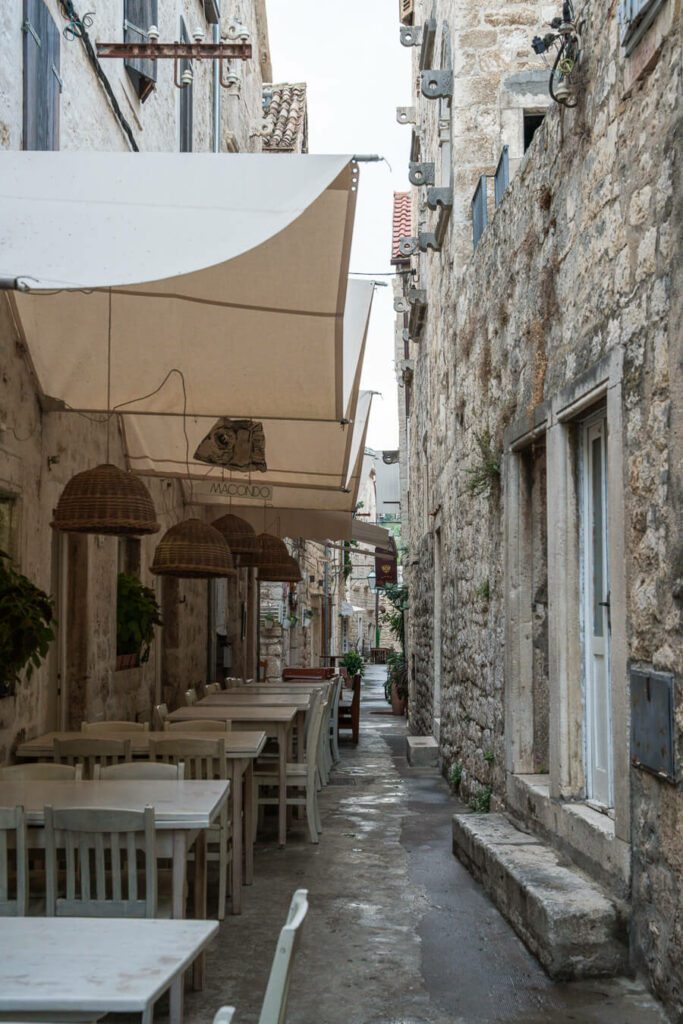 side street with macondo restaurant hvar