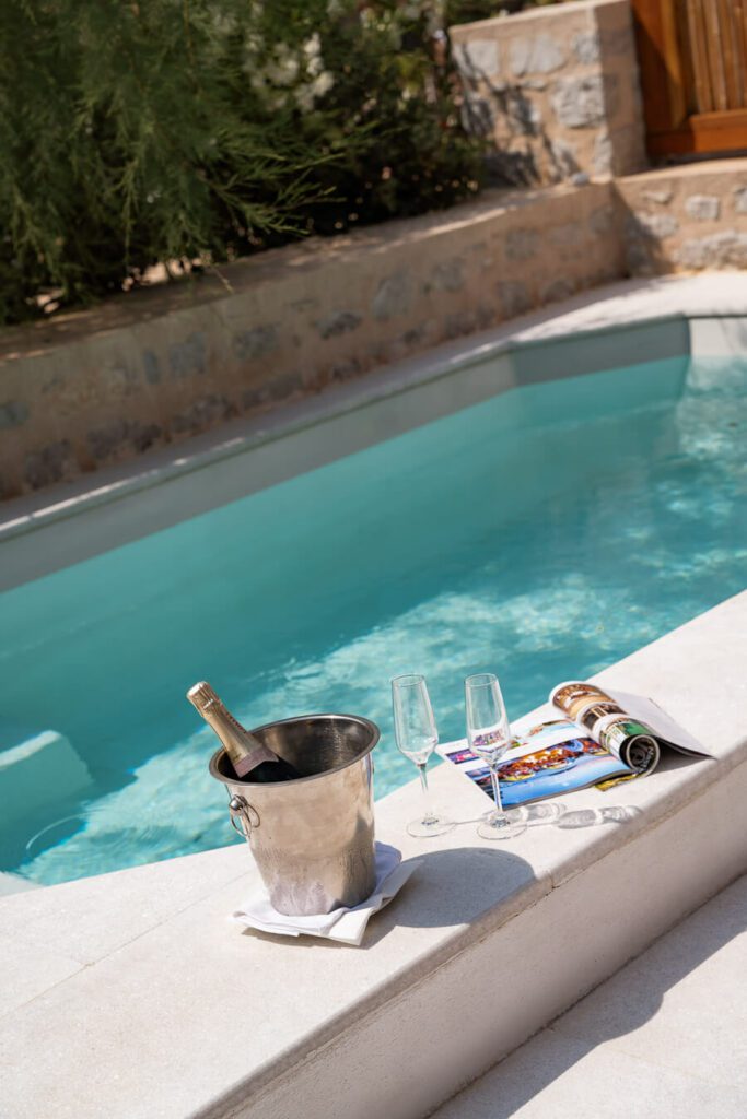 champagne by private plunge pool in mandraki beach resort