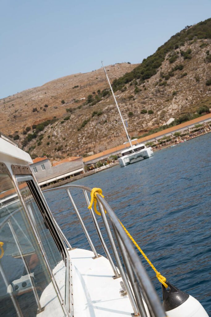 approaching mandraki bay in hydra greece on private boat