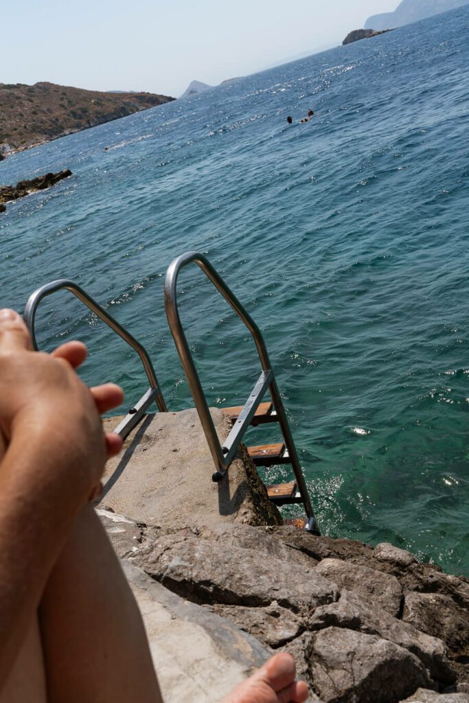 relaxing on hydronetta beach hydra