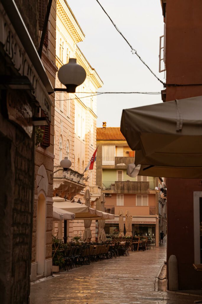 a street with table restaurants in zadar croatia