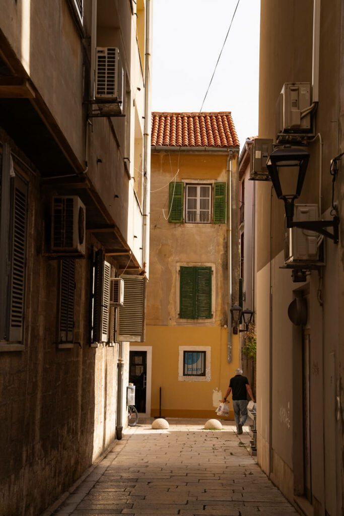 side street in zadar with local