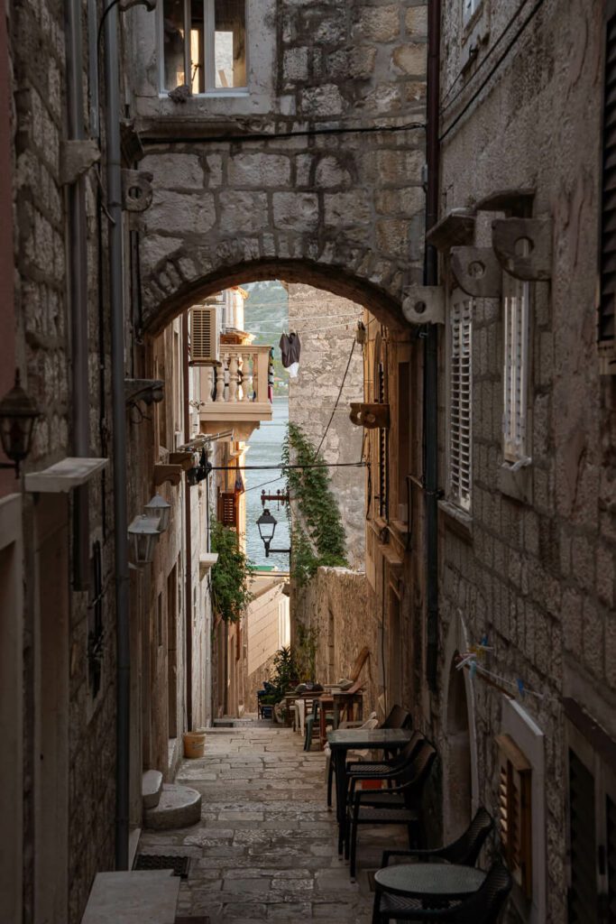 alley in korcula old town with restaurant