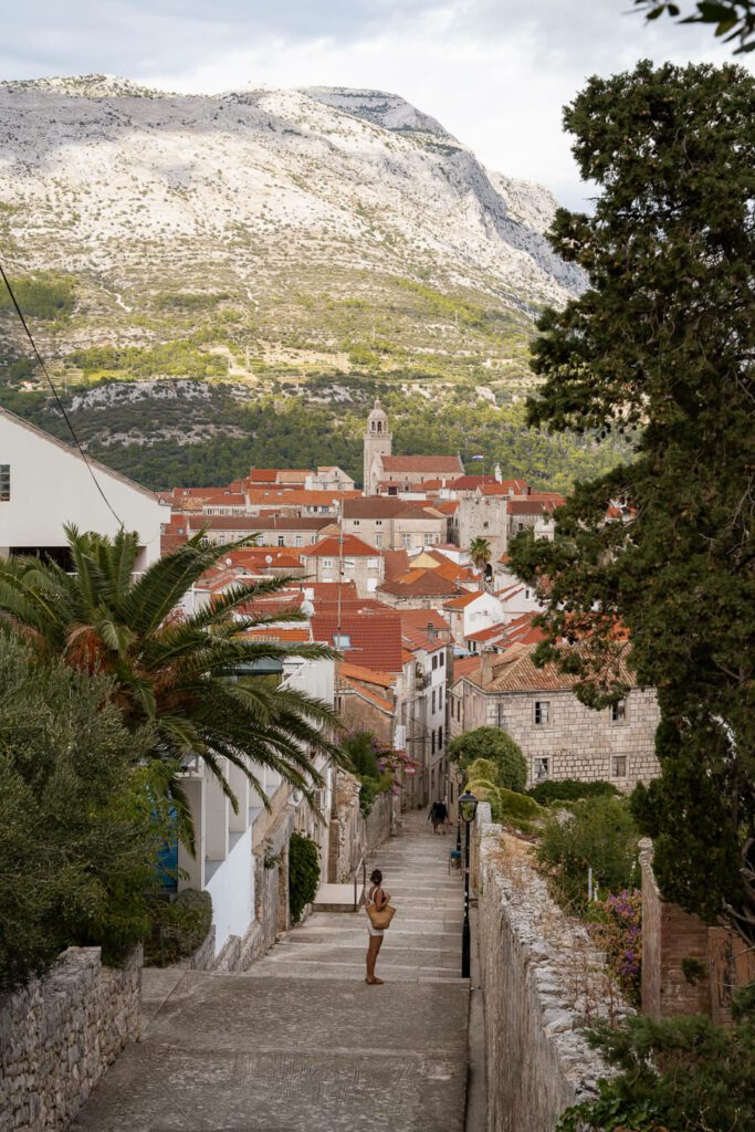 me on street with view of korcula town