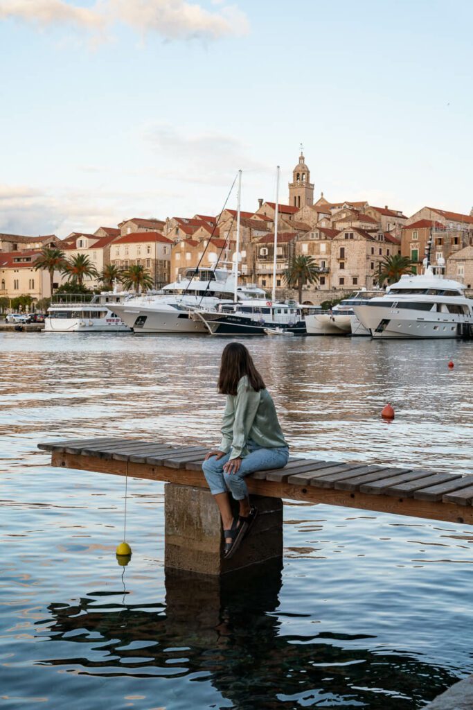 me on korcula island with town at sundown