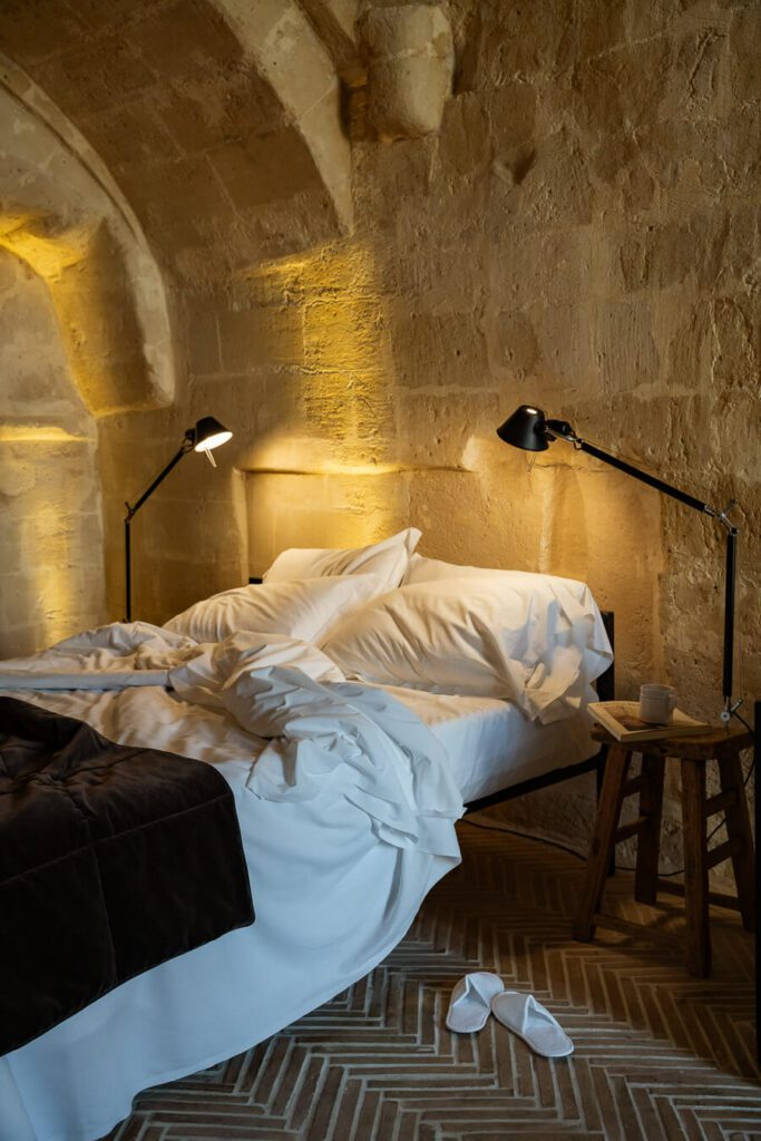 bed area in cave room at Il palazzotto matera