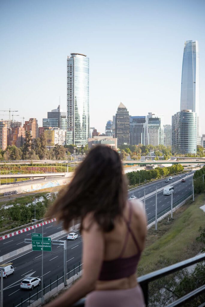 woman me with view of costanera center santiago chile