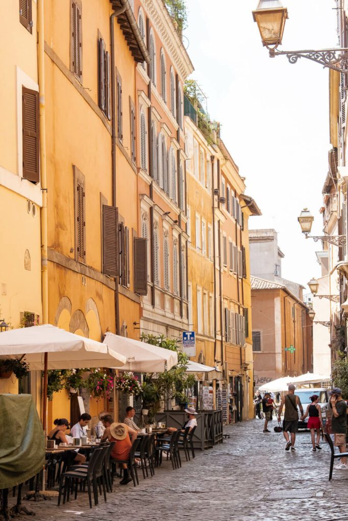 a street in trastavere with restaurant