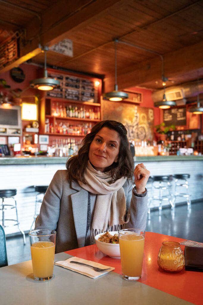 woman, me enjoy a meal at a portland restaurant/bar