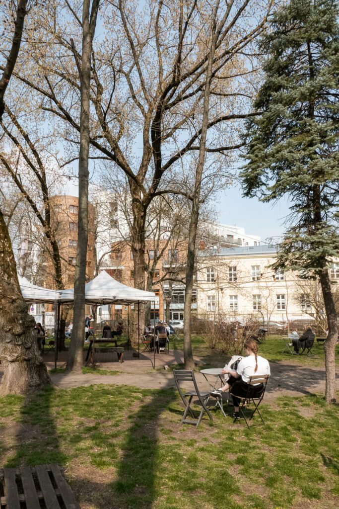 green square with cafe in praga warsaw