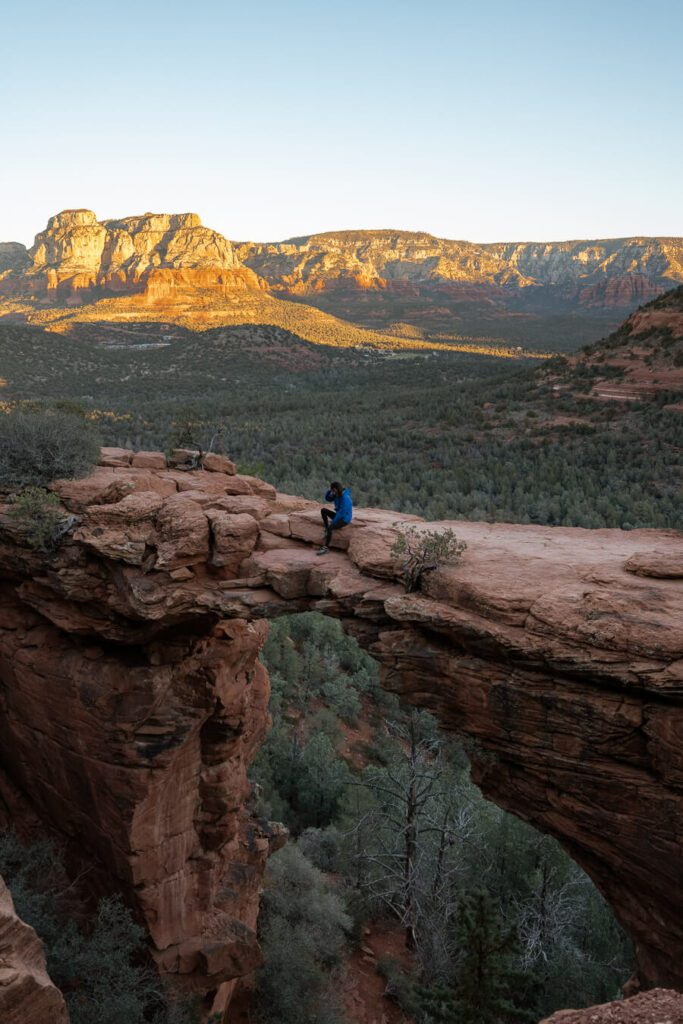 me on devil's bridge at sunrise in sedona, a great winter vacation idea