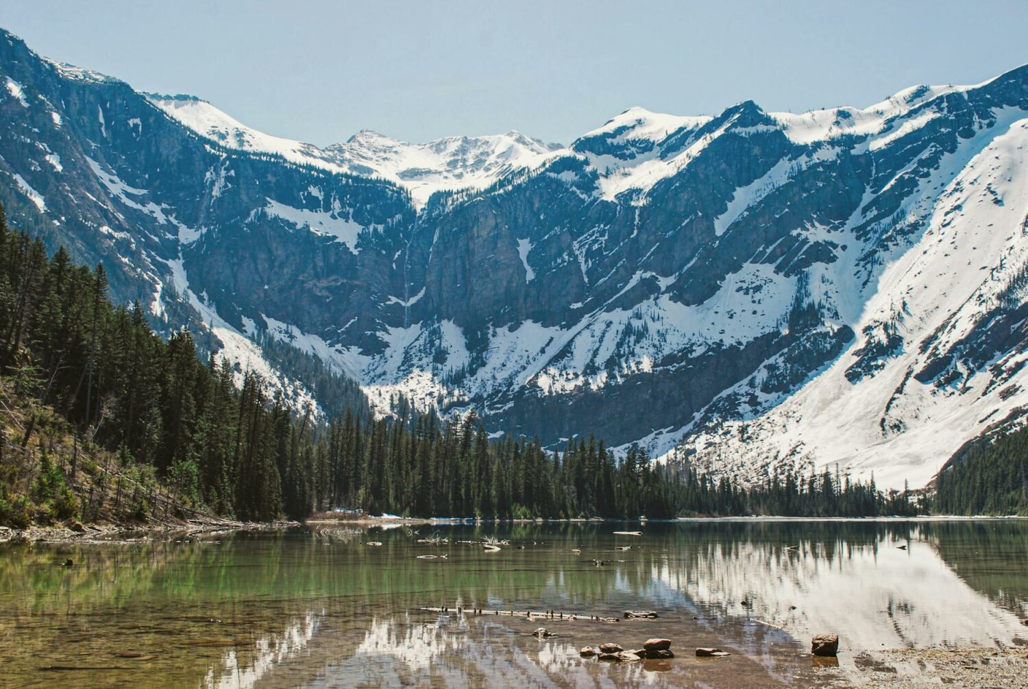 stream in a mountain valley covered with snow