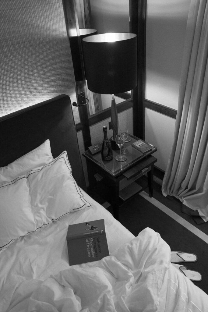 waking up at portrait milano- unmade bed wit champagne